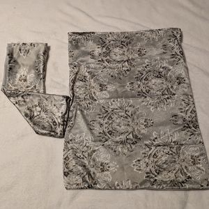 Set on 2 satin pillow cases. Floral. Neutral tones. Flap closure at opening.